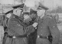 Decorating Sicherheitspolizei officers with medals at aleja Szucha 25 in Warsaw