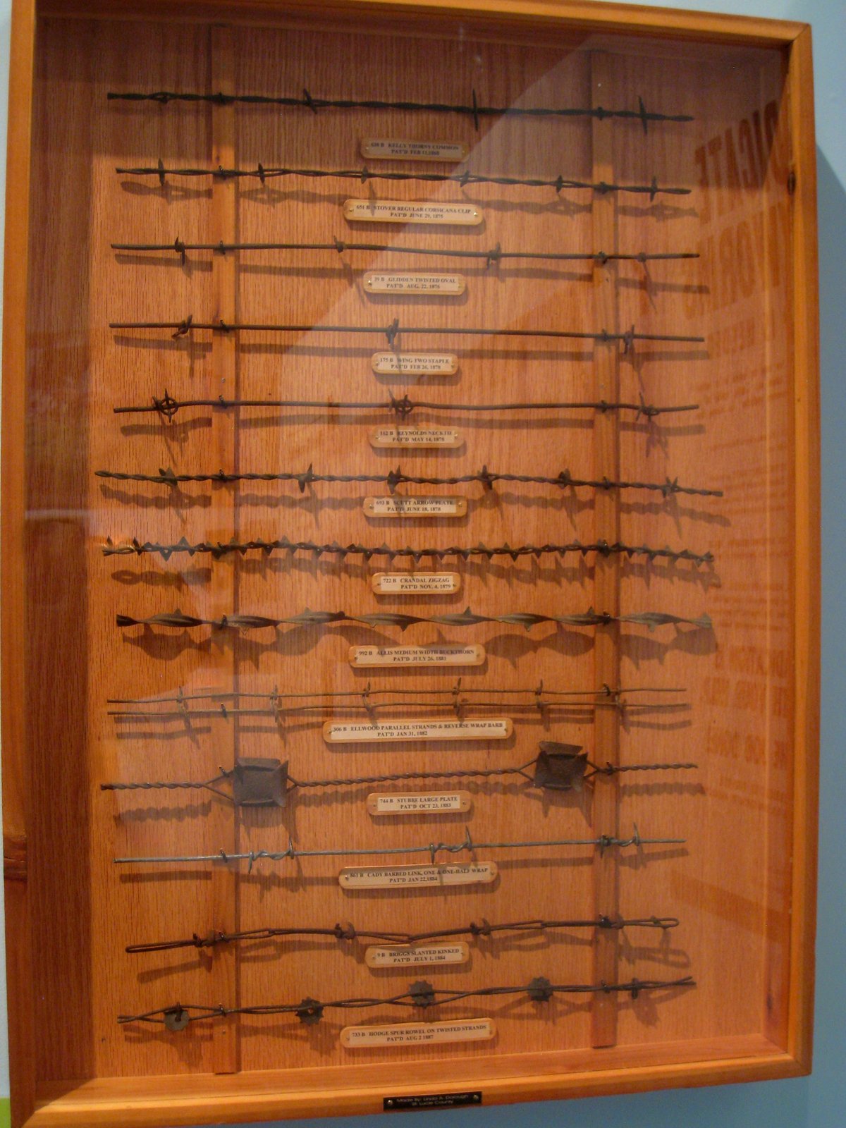 Various types of barbed wire displayed in a HistoryMiami museum exhibit in Florida