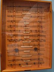Various types of barbed wire displayed in a HistoryMiami museum exhibit in Florida