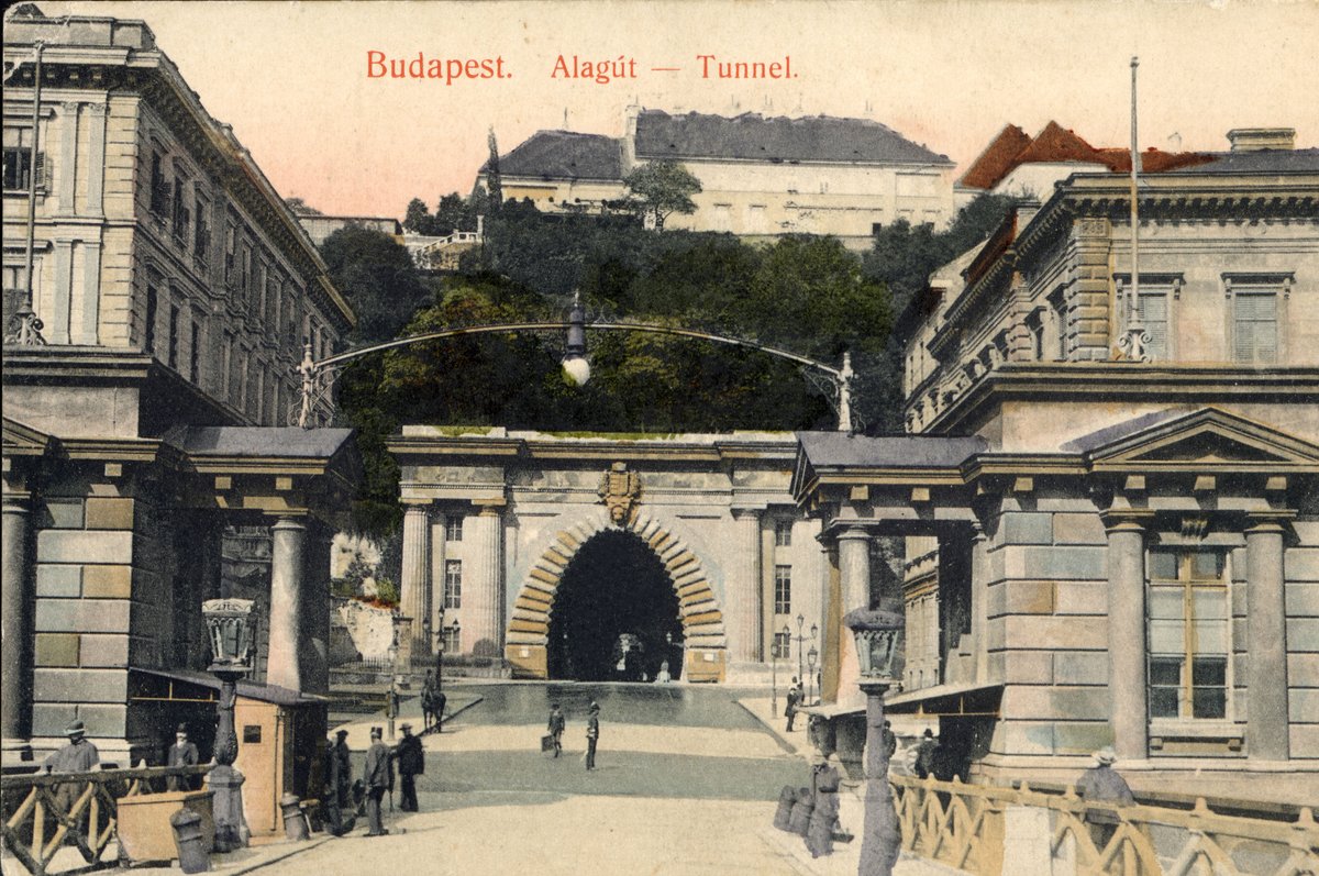 Historic Budapest tunnel entrance in 1907 with pedestrians and horse-drawn carriage