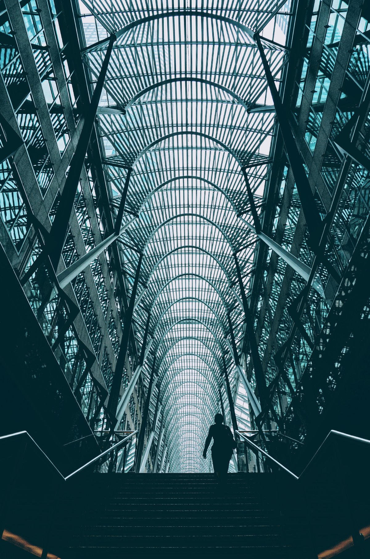 Spiral glass atrium staircase inside Brookfield Place, Toronto