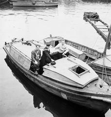 H.M.C.S. Haida motor cutter used for rescue after H.M.C.S. Athabaskan sinking in 1944 with crew members Stoker William Cummins, Leading Seaman William MacLure, Able Seaman Jack Hannam