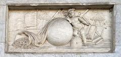 Close up of carved stone allegory above First Bank of the United States front doors with globe, baby, beehive, books, ships, and cornucopia coins representing early American economy