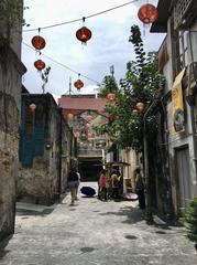 View of Kwai Chai Hong alley with historic murals from the southern end in Singapore