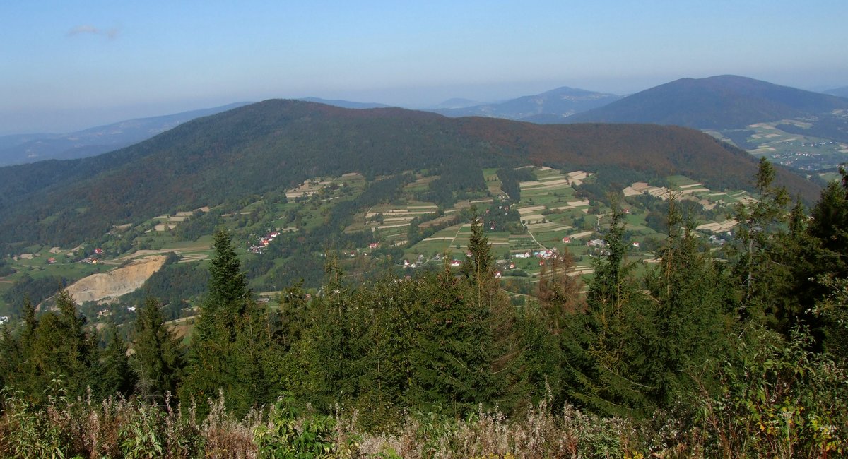 View of Szczebel mountain in Mszana Dolna Poland with green forests and clear sky