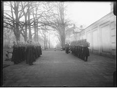 Changing of the honor guard at Belweder Palace during the anniversary of the November Uprising near the Royal Bath Park Officer Cadet School with a background of an inn building