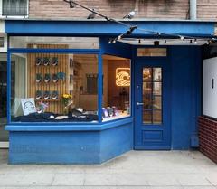Tajfuny bookshop storefront in Warsaw with books displayed in window