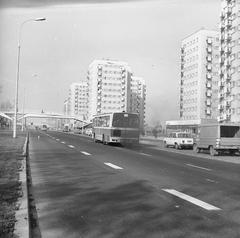 View northward on Czerniakowska Wschodnia street in 1976 showing a Jelcz PR110 bus, parked Fiat 125p and Żuk vehicles, pedestrian footbridge and residential blocks
