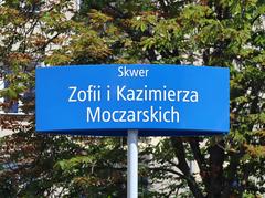 Street sign for Skwer Zofii i Kazimierza Moczarskich at the intersection of Armii Ludowej Avenue and Mokotowska Street in Warsaw