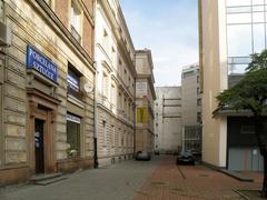 Scenic view of Piękna Street in Warsaw with historic buildings and green trees