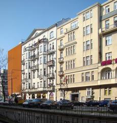 View of Żurawia Street in Warsaw with modern buildings and bustling street activity