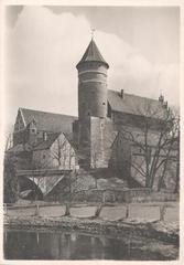 Medieval Warmian Cathedral Chapter Castle in Olsztyn with historic architecture and surrounding greenery