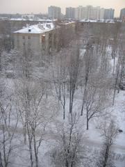 Winter view of Izmailovsky Boulevard and Srednyaya Pervomayskaya Street with new high-rise buildings in the background in Moscow