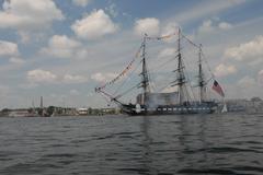 USS Constitution firing 17-gun salute with cannon at Coast Guard base Boston North End