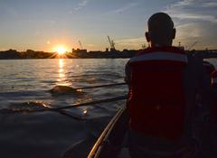 Navy Chief Petty Officer Selectees rowing a Cornish Gig boat during Chief Petty Officer Heritage Week aboard USS Constitution
