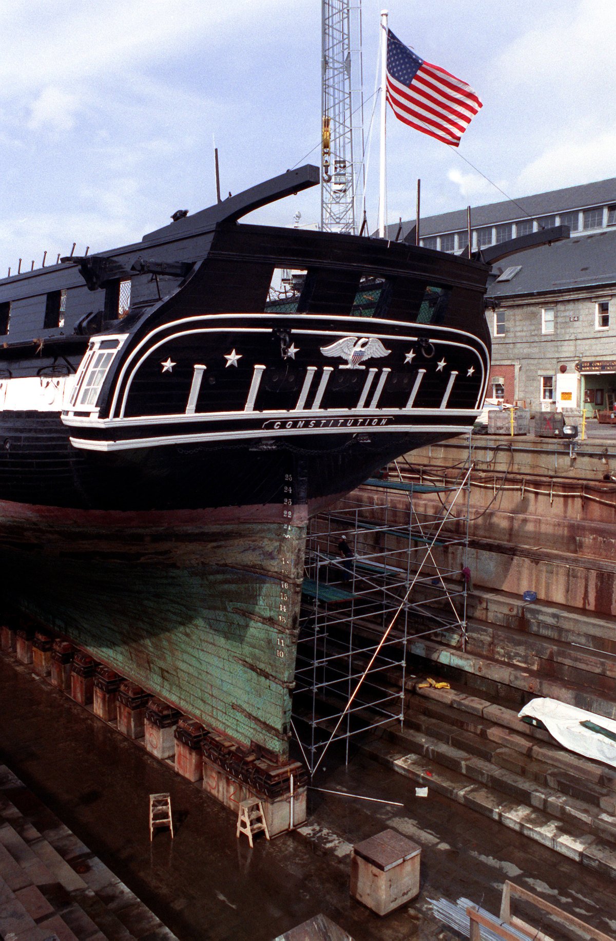 stern view of 44-gun sail frigate USS Constitution in dry dock at Charleston Memorial Shipyard