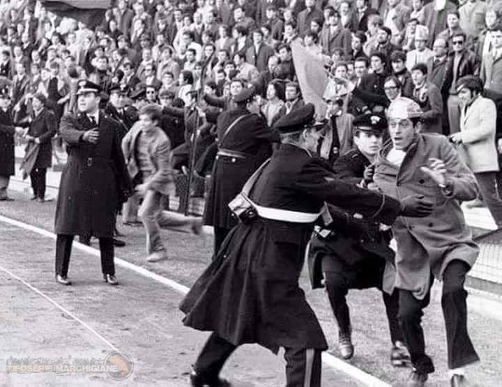 Football fans invading the pitch at Stadio Cino e Lillo Del Duca during Ascoli vs Sambenedettese match on March 1, 1970