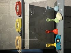 Collection of vintage telephones displayed at the Musée des sciences et des techniques Léonard de Vinci
