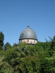 Exterior view of the Observatoire de Strasbourg with its historic architecture and large telescope dome under a blue sky