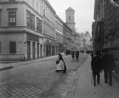 Vaci utca street view from Sorhaz utca with Belvarosi Szent Mihaly church in the center