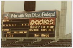 San Diego Padres scoreboard at Jack Murphy Stadium announcing Smokey Bear Baseball Card Night