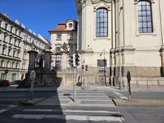Street view of Pražská Resslova ulice with surrounding buildings and objects