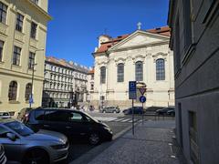 Street view of Pražská Resslova ulice with surrounding buildings and objects