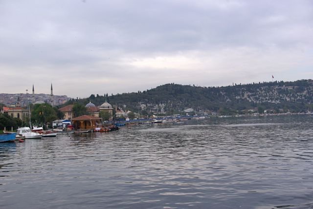 Ferry ride to Eyüp with passengers on deck and cityscape in the background