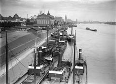 Historical view of Rheinauhafen in Cologne looking north with Hohenzollern Bridge and 1913 suspension bridge