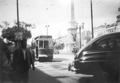 Classic yellow Lisbon tram on a city street