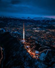 Koktobe Tower in Almaty Kazakhstan during dusk with illuminated surroundings