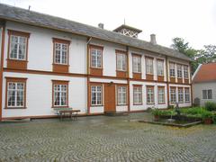 Exterior view of Ringve Museum in Trondheim, Norway with classical architecture and lush green surroundings