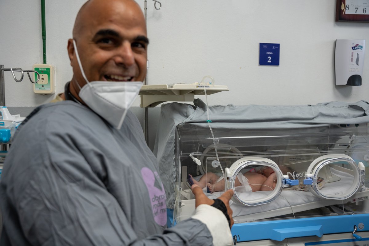U.S. Air Force medical personnel caring for a newborn baby at San Bartolo National Hospital in El Salvador during AMISTAD 2025
