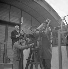 Professor Luigi Carmera examining instruments at the observatory in Naples, Italy in 1938