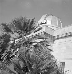 Historic observatory building in Naples, Italy with a dome and surrounding structures in 1938