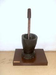 Old wooden mortar and pestle for crushing coffee grains at Casa do Bandeirante, São Paulo, Brazil