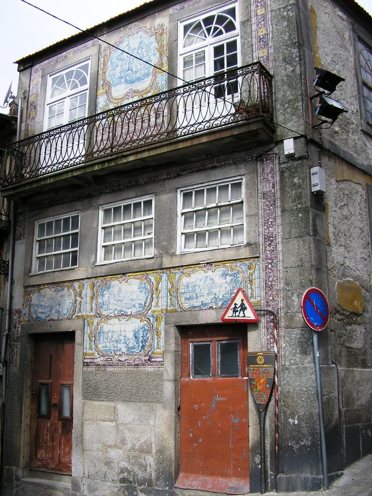 House with traditional azulejos tiles decoration on São Miguel street in Porto, Portugal