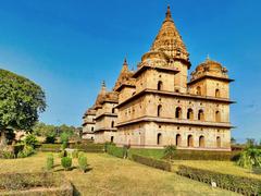 16th to 18th century Bundela Chhatris funerary monuments in Orchha, Madhya Pradesh with domed canopies and Rajput-Mughal architectural style by the Betwa River