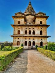 Multistoried Bundela Chhatris with domed canopies and spires on Betwa River bank in Orchha, Madhya Pradesh