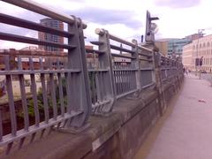 The restored wall where the Cathedral Landing Steps originally stood with a modern fence on top