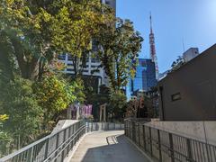 Azabudai Hills panoramic view on opening day with modern high-rise buildings and green rooftop gardens under a clear blue sky