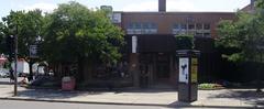 De Castelnau Montreal Metro Station entrance with stairs and greenery