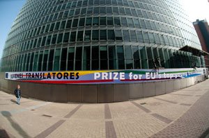 Banner for European Commission Juvenes Translatores translation contest displayed on EU headquarters building in Brussels