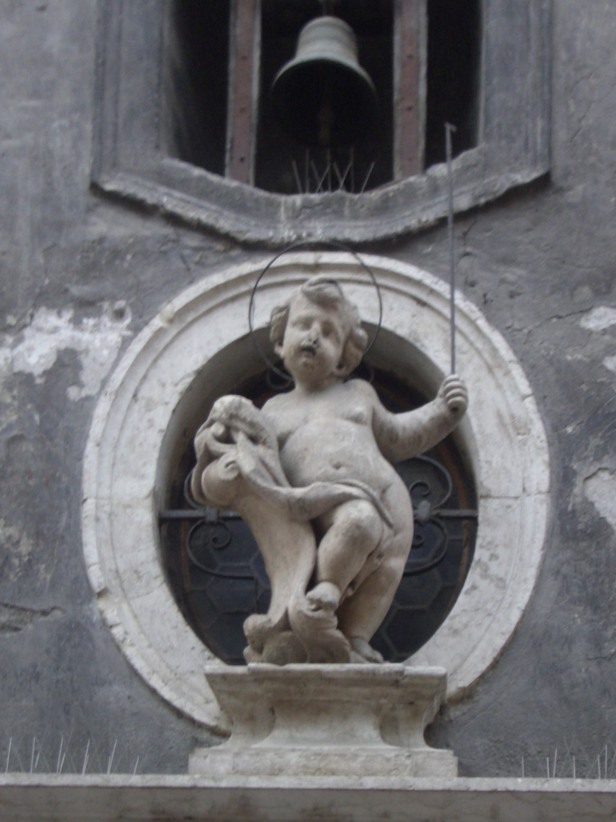 Statue of Simon of Trent on facade of palace in Trento on Via del Simonino