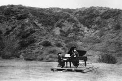 Two women performing on a barn door stage at the first known musical event at the Hollywood Bowl, circa 1920