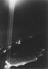 Hollywood Bowl stage with four large searchlights representing the four absolute moral standards of Moral Re-Armament in 1939