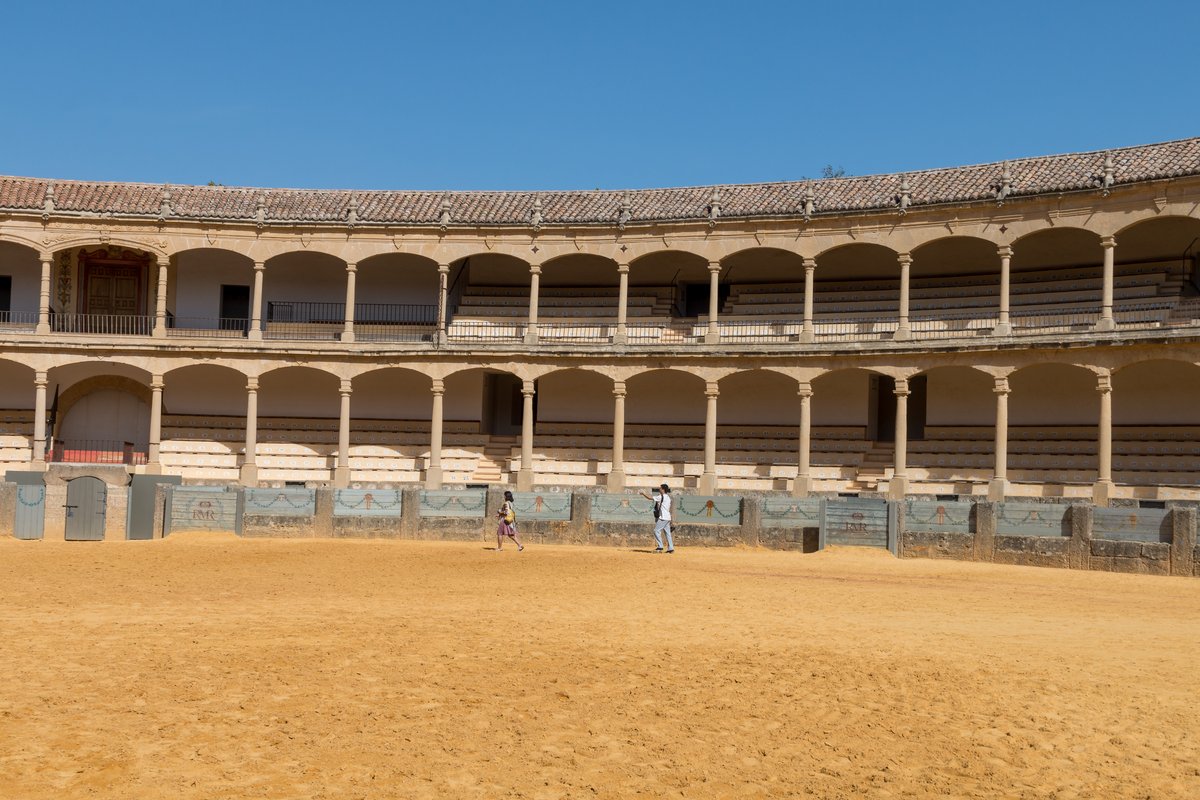 Stone arches of Arena Ronda bullring in Ronda, Spain