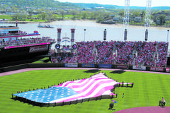 85 Wright-Patterson AFB members holding American flag during national anthem at Cincinnati Reds-Chicago Cubs opening day baseball game