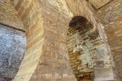 Baños de Comares in Alhambra, Granada, Spain with intricate Islamic architectural details and pool