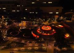 Fountain in LA Grand Park illuminated with colors of the Belgium flag at night